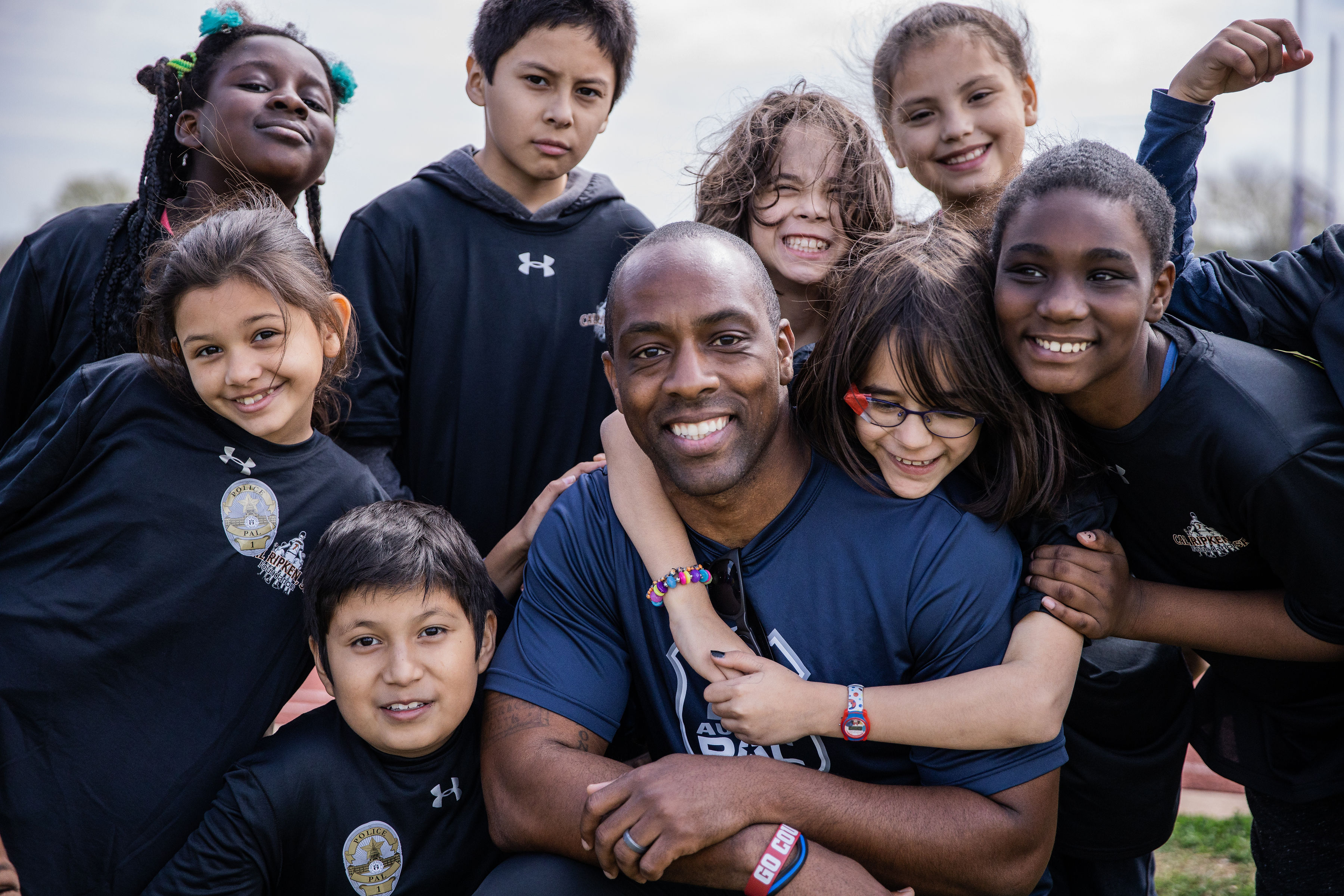 Austin Police Department Officer Jeremy Bohannon with youth at a clinic