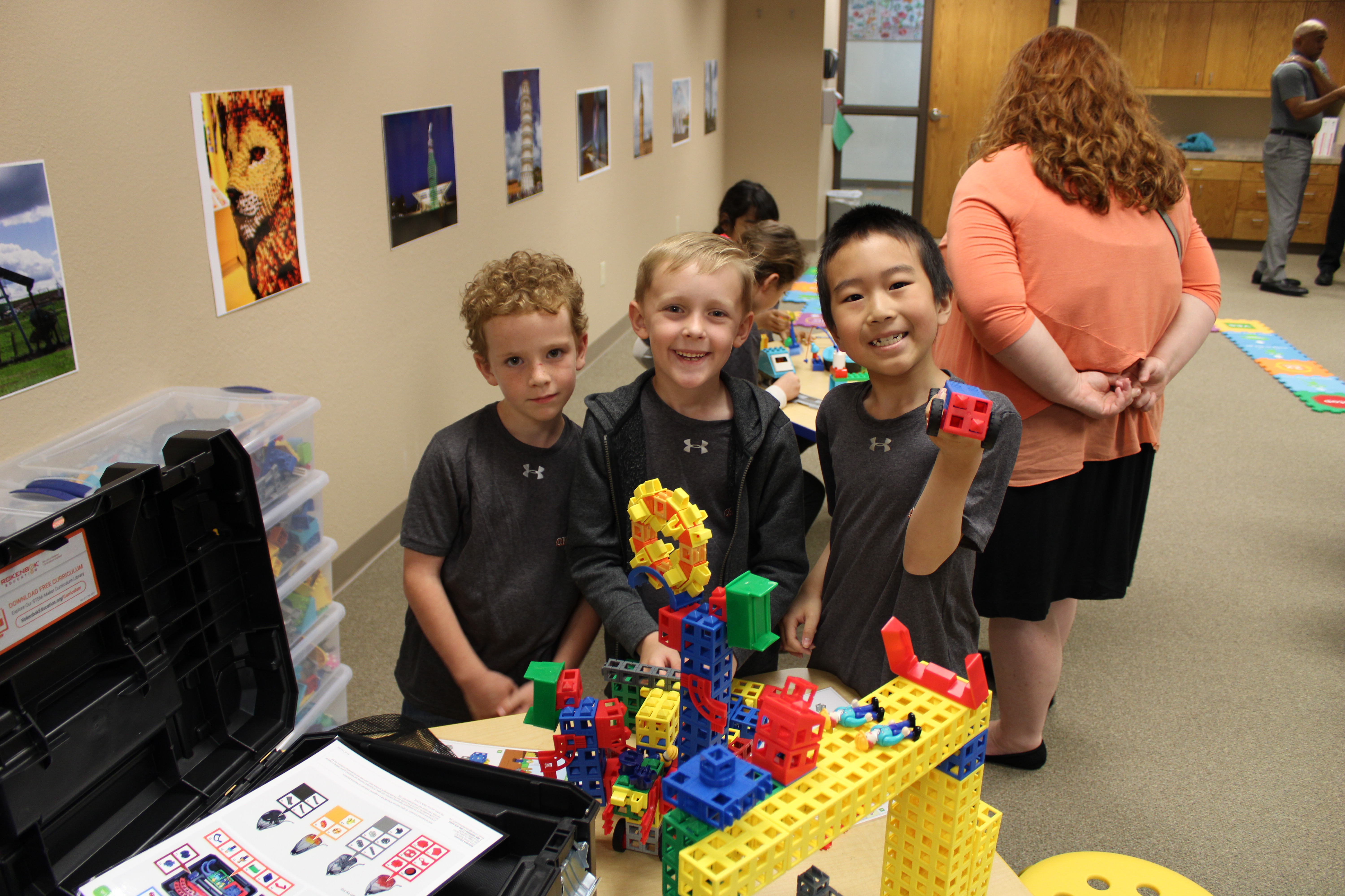 Three boys holding up ROK Blocks from Kid Spark Education.